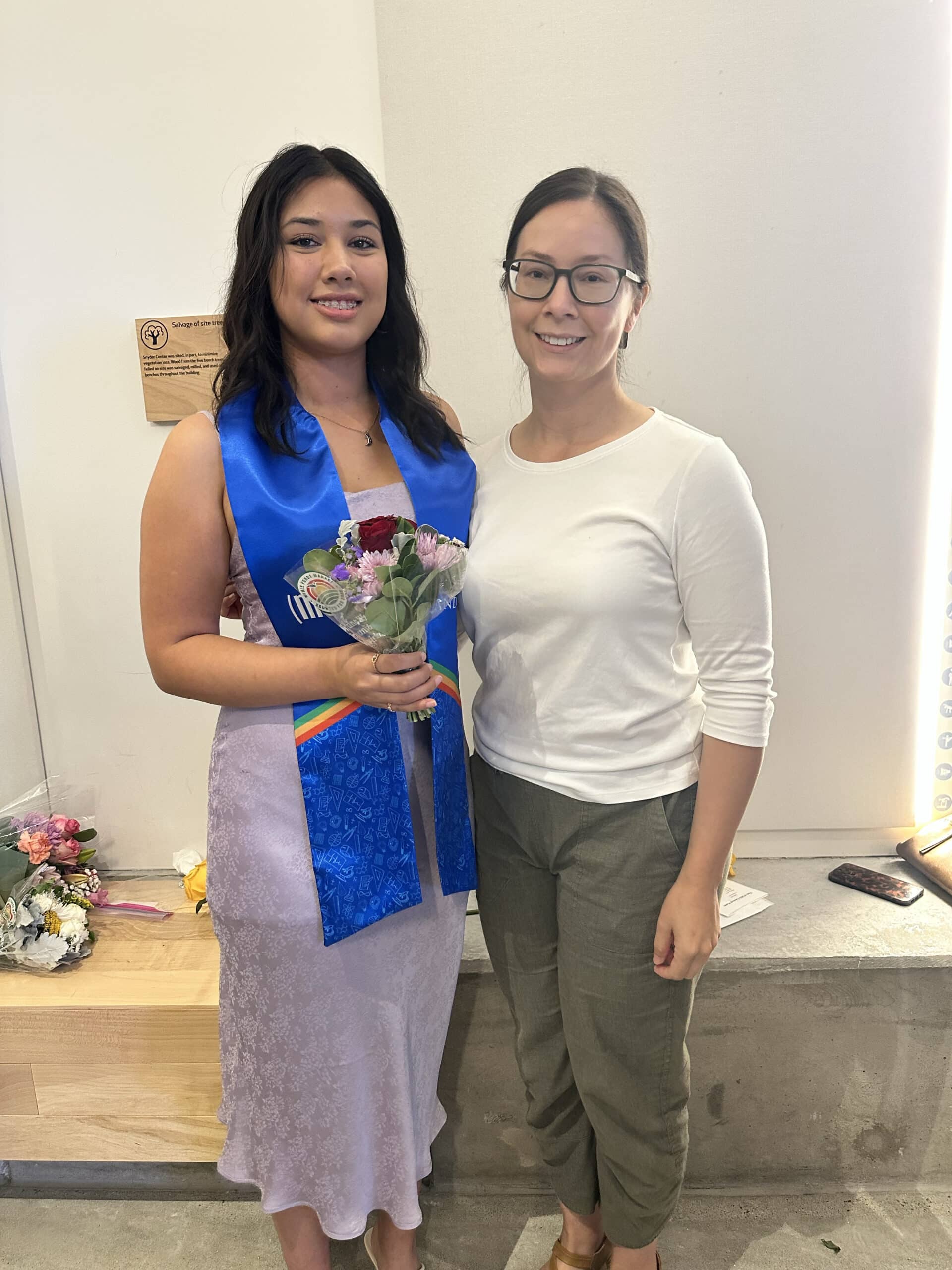 Helen Russette (right) standing next to her daughter (left) at her graduation from the MS(2) program at Phillips Academy.